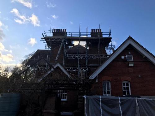 Double chimney stack for re-pointing.